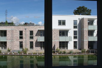Neubau eines Mehrfamilienhauses mit 35 WE und 18 Reihenhäusern in Scharbeutz <br>Bauzeit: 2016-2017 <br>Leistungsspektrum: HOAI Phase: 1-9
